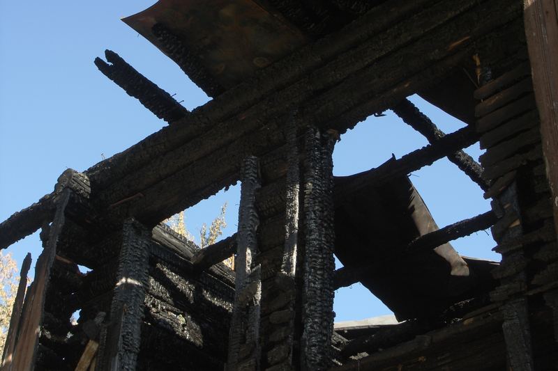 Charred house exterior after fire